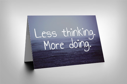 Rain falling on a watery scene with 'Less Thinking More Doing' quote