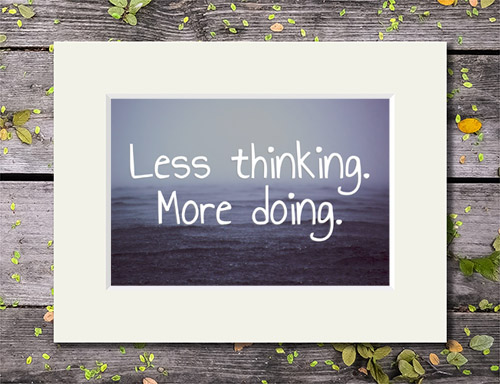 Rain falling on water with 'Less Thinking. More Doing.' quote