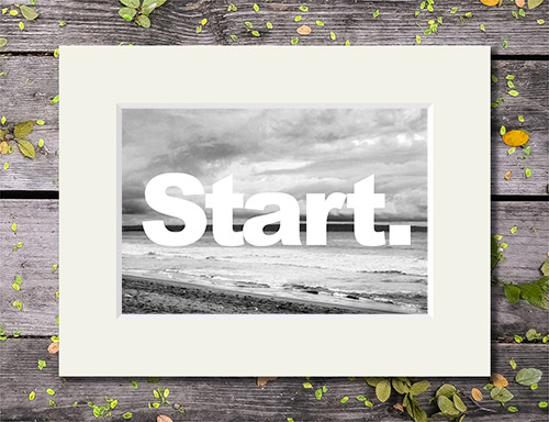 Black and white beach scene with 'Start' quote