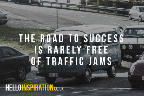 Traffic jam with 'The Road To Success Is Rarely Free of Traffic Jams' quote