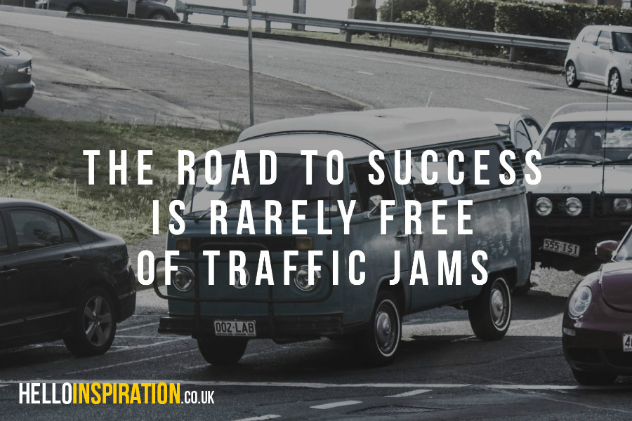 Traffic jam with 'The Road To Success Is Rarely Free of Traffic Jams' quote